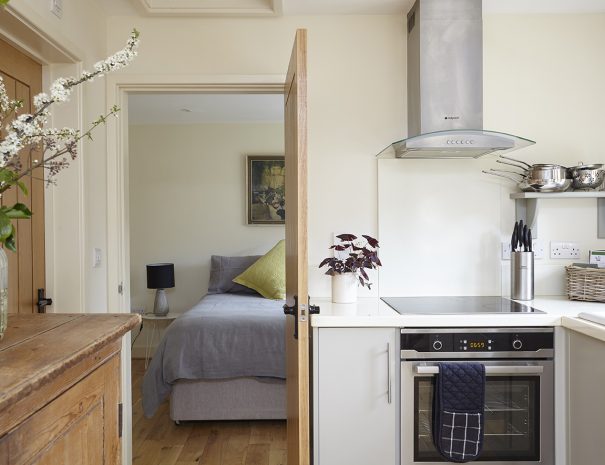 Kitchen looking through to bedroom